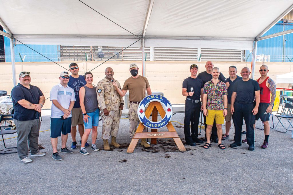 Members of Combined Task Force 150 and HMCS Calgary show their new look after getting their hair, beards, and ‘staches shaved off for a charity event on May 24 in Manama, Bahrain, during Operation Artemis. The two groups have self-isolated throughout their respective operations and remained physical distanced from each other during the event to ensure the health and safety of all involved. Photos by Cpl Lynette Ai Dang, Imagery Technician