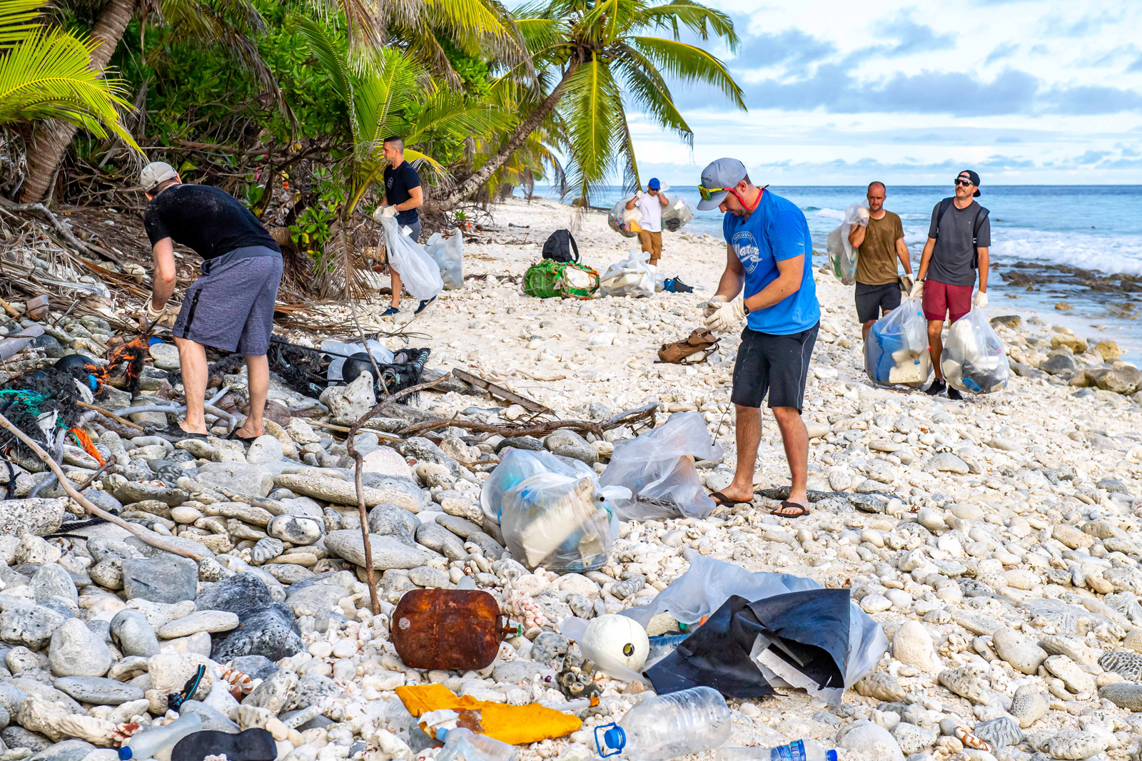 Members of HMCS Calgary clean a portion of Diego Garcia’s beaches on June 20 in Diego Garcia, British Indian Ocean Territory. Photos by Cpl Lynette Ai Dang, HMCS Calgary Imagery Technician