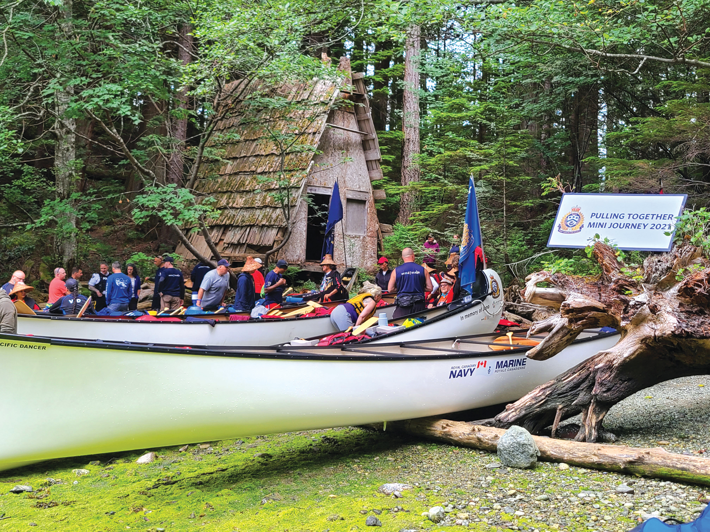 Participants of the Pulling Together canoe journey come ashore somewhere in Howe Sound. 
