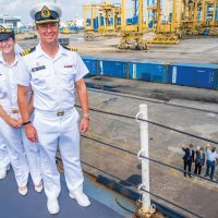 Commander Mark O’Donohue, HMCS Calgary Commanding Officer; Cdr Meghan Coates, Executive Officer; and Chief Petty Officer First Class Mark Chambers, Coxswain, stand on the ship’s forecastle as Cameron MacKay, Canadian Ambassador to Indonesia and Timor-Leste; Diedrah Kelly, Canadian Ambassador to the Association of Southeast Asian Nations; Colonel Andrew Cleveland, Canadian Defence Attaché to Indonesia, the Philippines, Brunei and Timor-Leste; and two of their staff members wave farewell from the jetty as the ship was alongside in Jakarta, Indonesia, July 2.