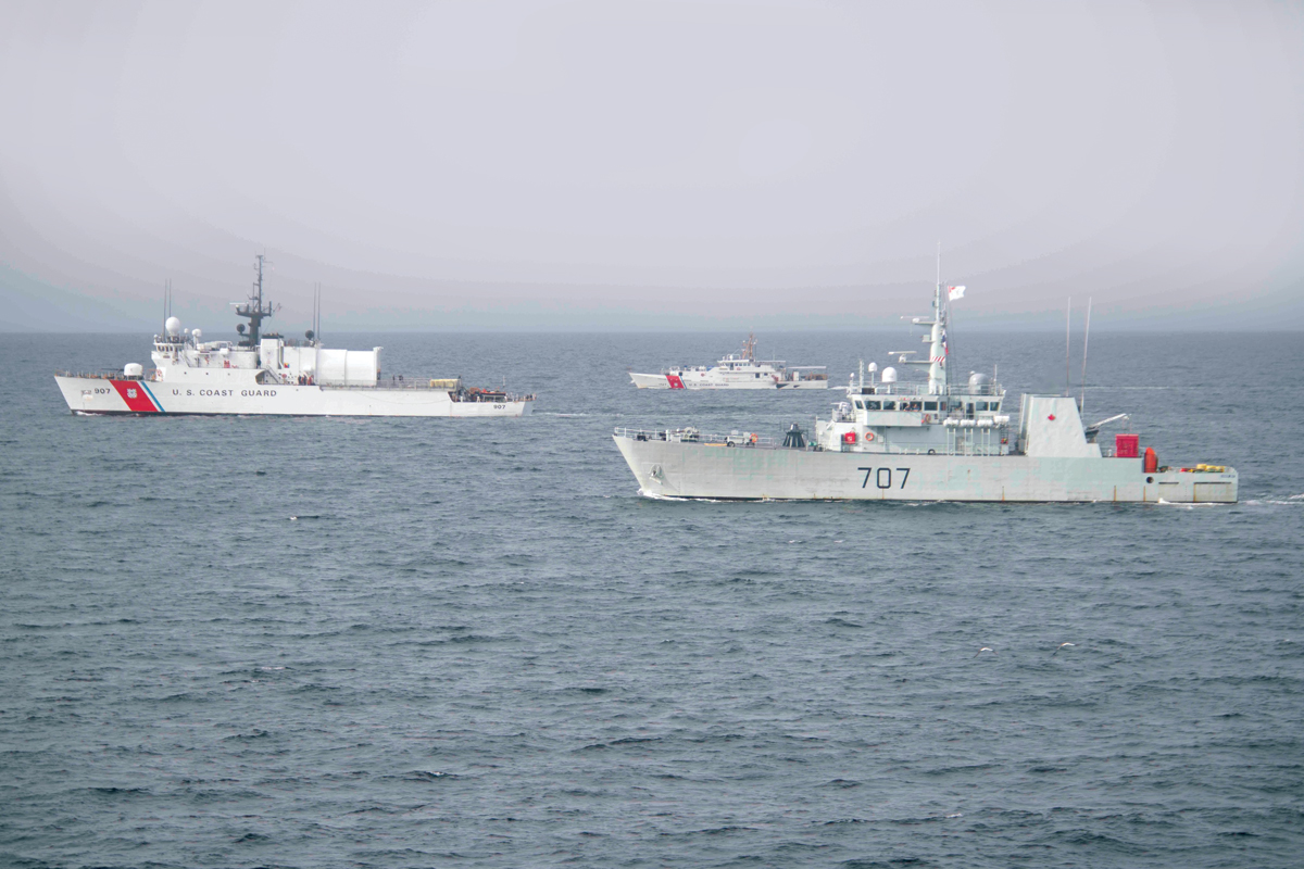 HMCS Goose Bay is seen sailing alongside US Coast Guard Ships Escanaba (left) and Richard Snyder (centre) during the early portion of Operation Nanook. Photo by Cpl Simon Arcand