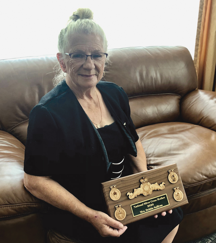 National Silver Cross Mother Debbie Sullivan with a plaque presented to her by Cmdre Christopher Robinson, Commander Canadian Fleet Atlantic. Sullivan officially holds the role of National Silver Cross Mother until Nov. 1, 2021. Photo by Joanie Veitch, Trident Staff