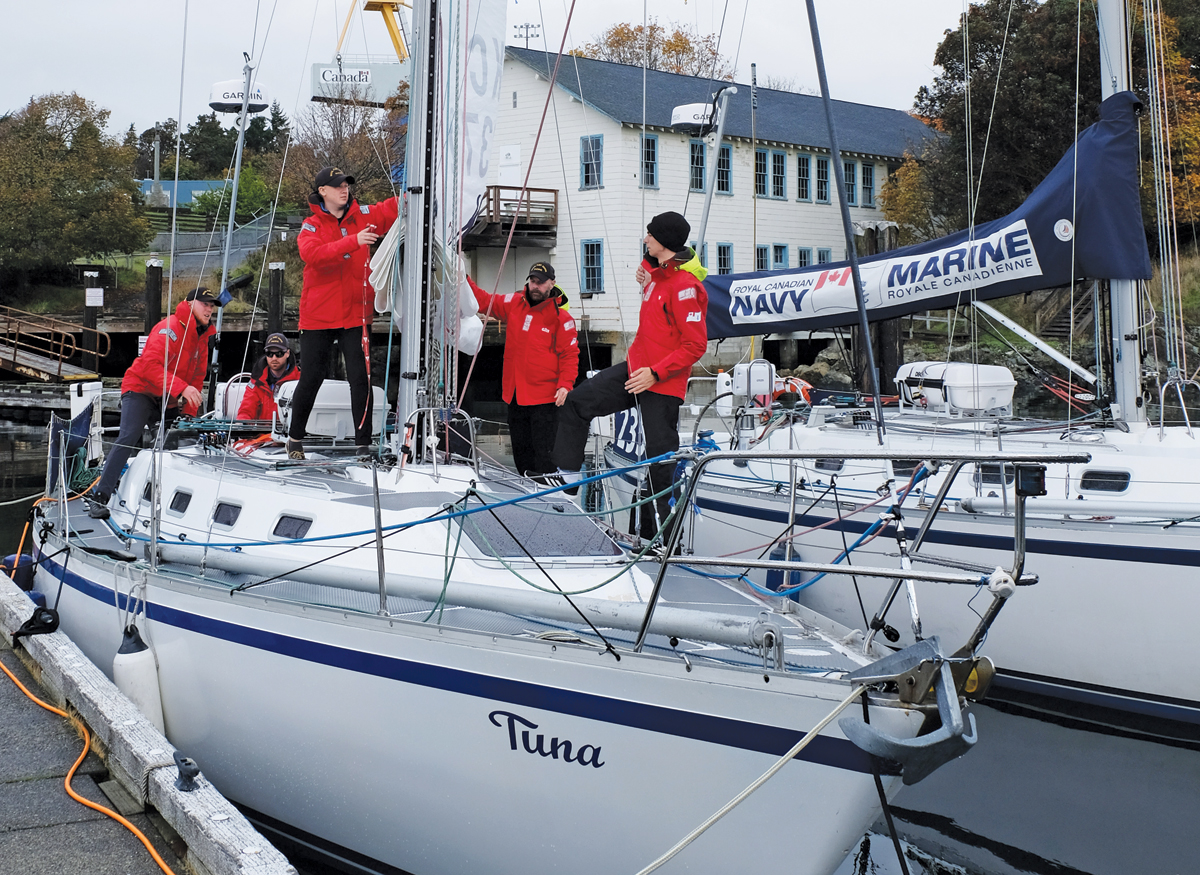 Navy race participants conduct pre-sail inspection of Tuna. Photo by Michael McWhinnie