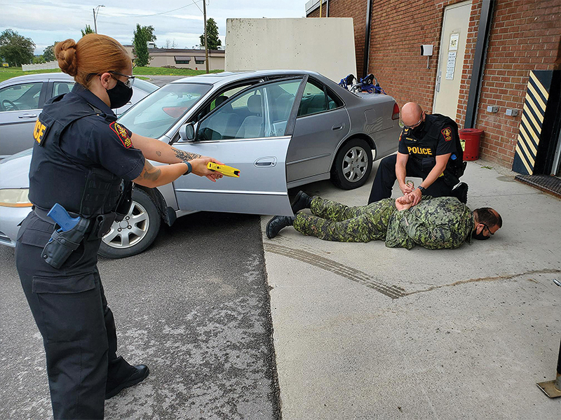 Military Police unit members in Kingston, Ontario, armed with Conducted Energy Weapons train in accordance with standard police practices.