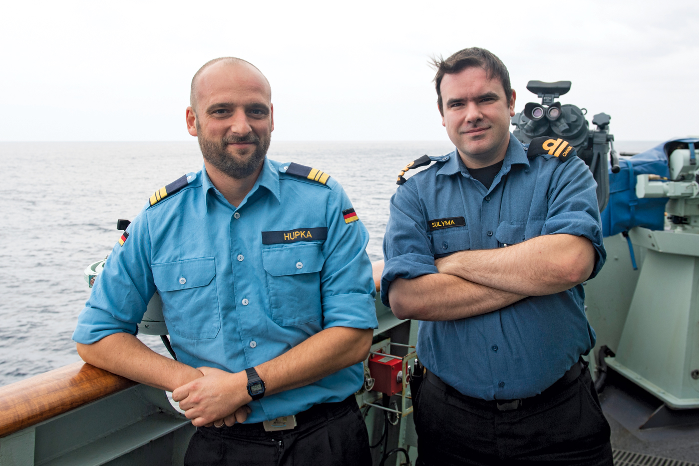 Kapitänleutnant Tim Hupka, a German Exchange Officer, and Lieutenant (Navy) Christopher Sulyma, on the bridge wing of HMCS Winnipeg. Photo by MCpl Andre Maillet, MARPAC Imaging Services