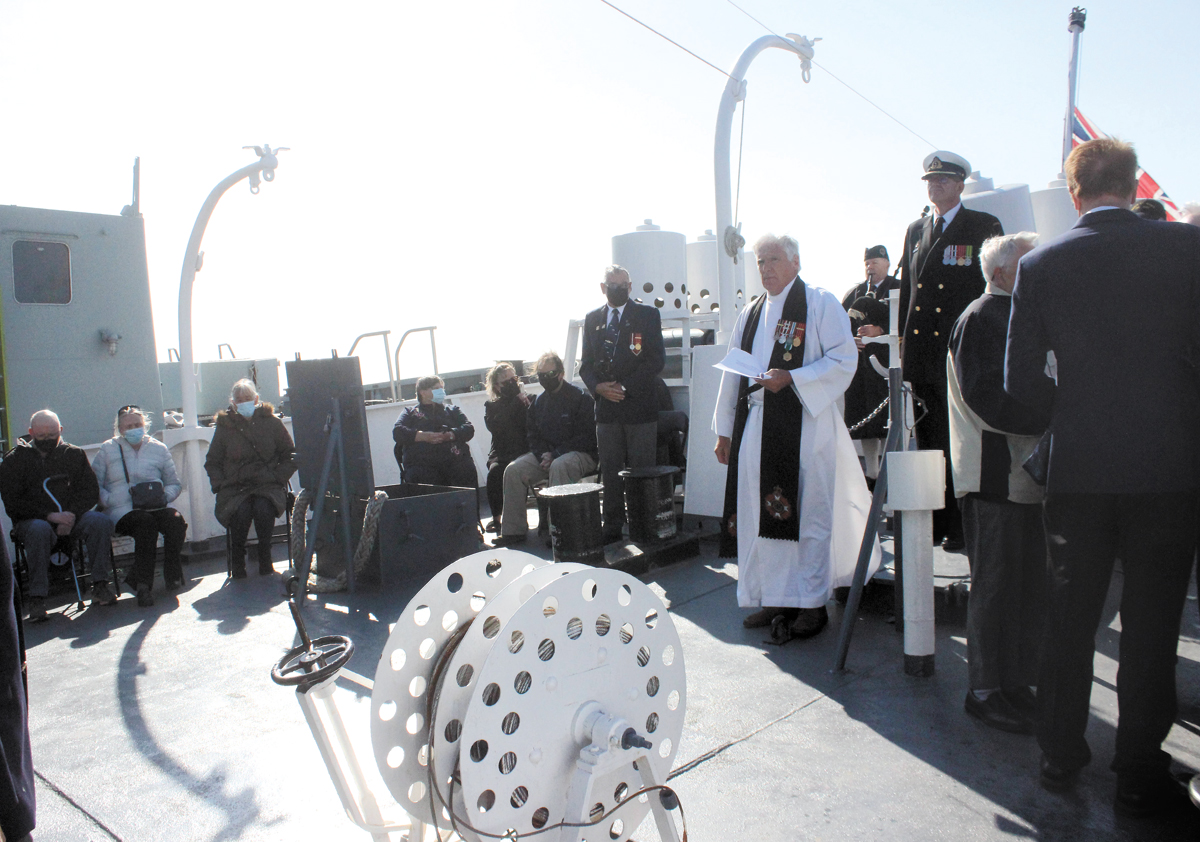 Padre Andrew Cooke, Chaplain of the Canadian Naval Memorial Trust, leads a Committal of Ashes ceremony on board HMCS Sackville on Oct. 8. Photo by Ryan Melanson, Trident Staff