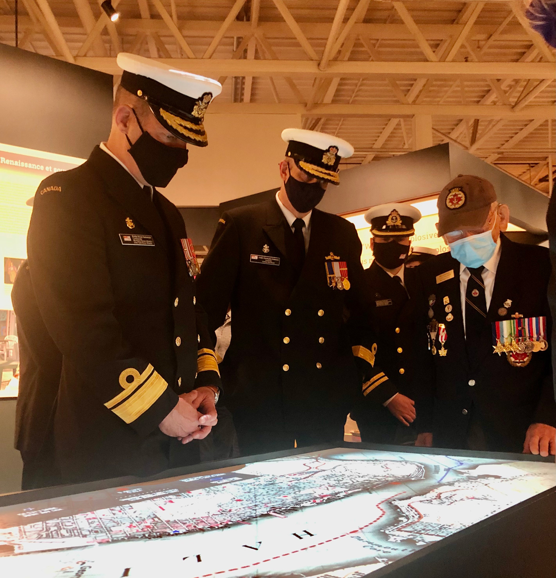 From left: Cmdre Christopher Robson, Commander Canadian Fleet Atlantic; RAdm Brian Santarpia, Commander Maritime Forces Atlantic; Capt (Retired) Earle Wagner, Merchant Navy veteran; and Roger Marsters, curator of Marine History at the Maritime Museum of the Atlantic. Photo by Joanie Veitch