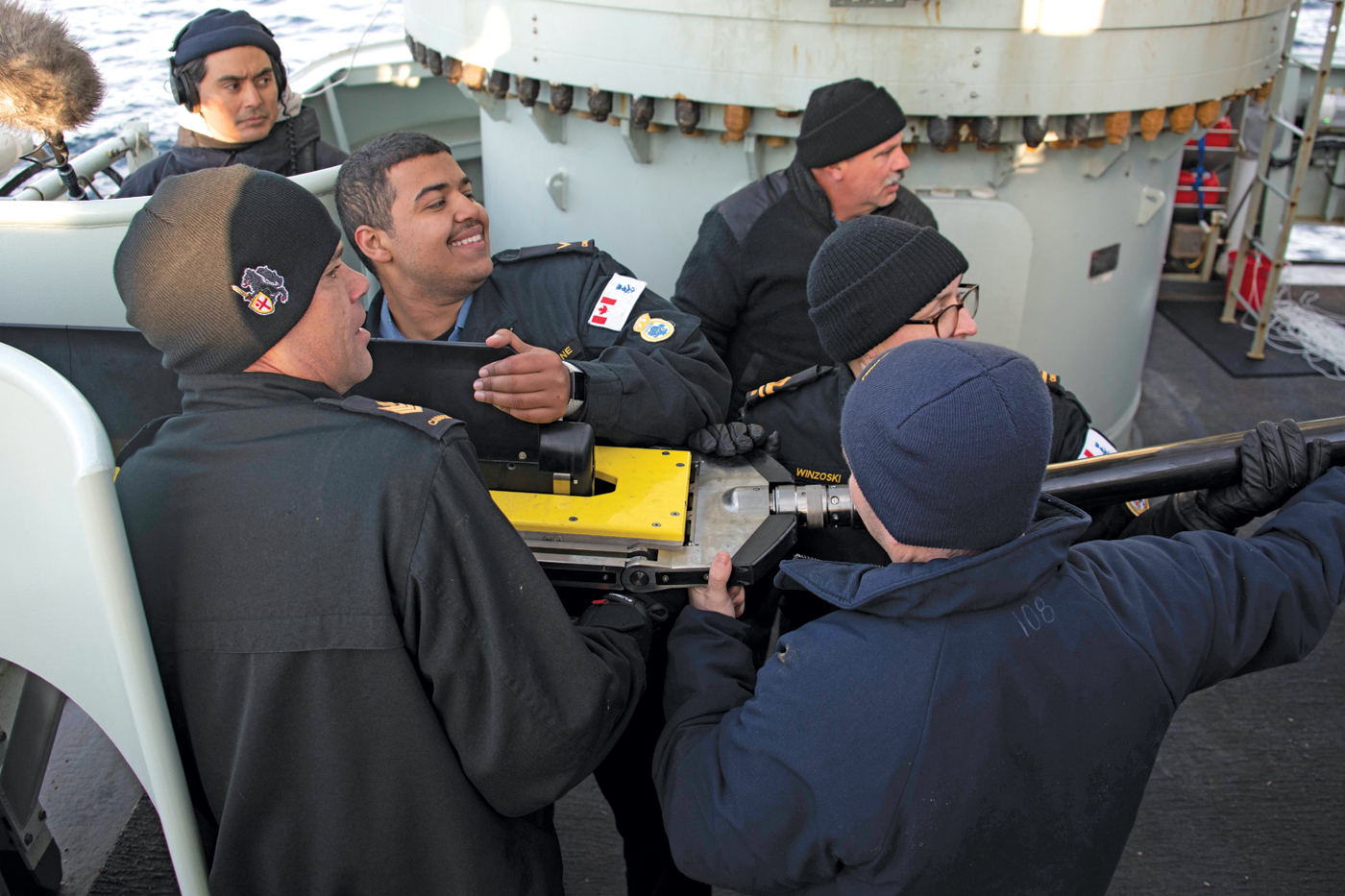 HMCS Harry DeWolf crew members help launch Defence Research and Development Canada’s new Towed Reelable Active-Passive Sonar, which was tested during the ship’s passage through Northern waters earlier this fall. Photo by Corporal Simon Arcand, Canadian Armed Forces Photo