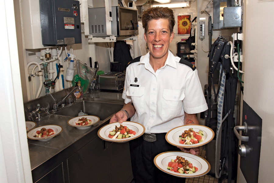 S3 Lorraine Cléroux serves up a dish. Photo by Master Corporal Andre Maillet, MARPAC Imaging Services/HMCS Winnipeg