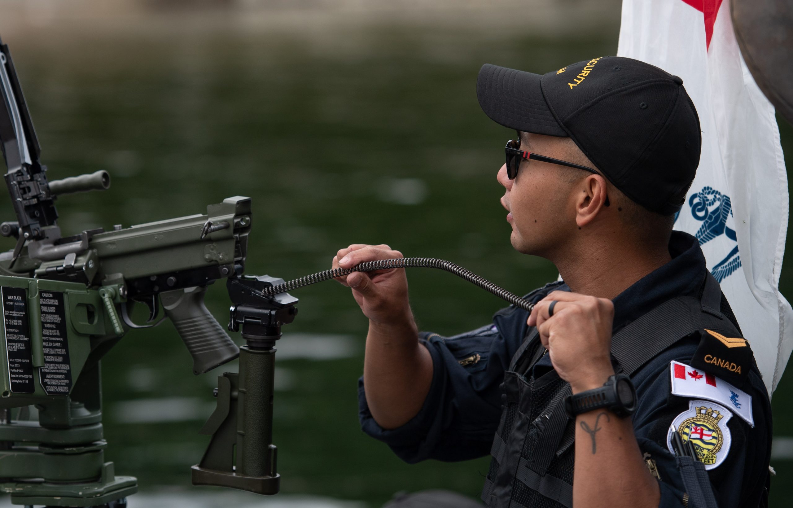 Sailor 1st Class Paul Ayo assembles the C9 Machine Gun.