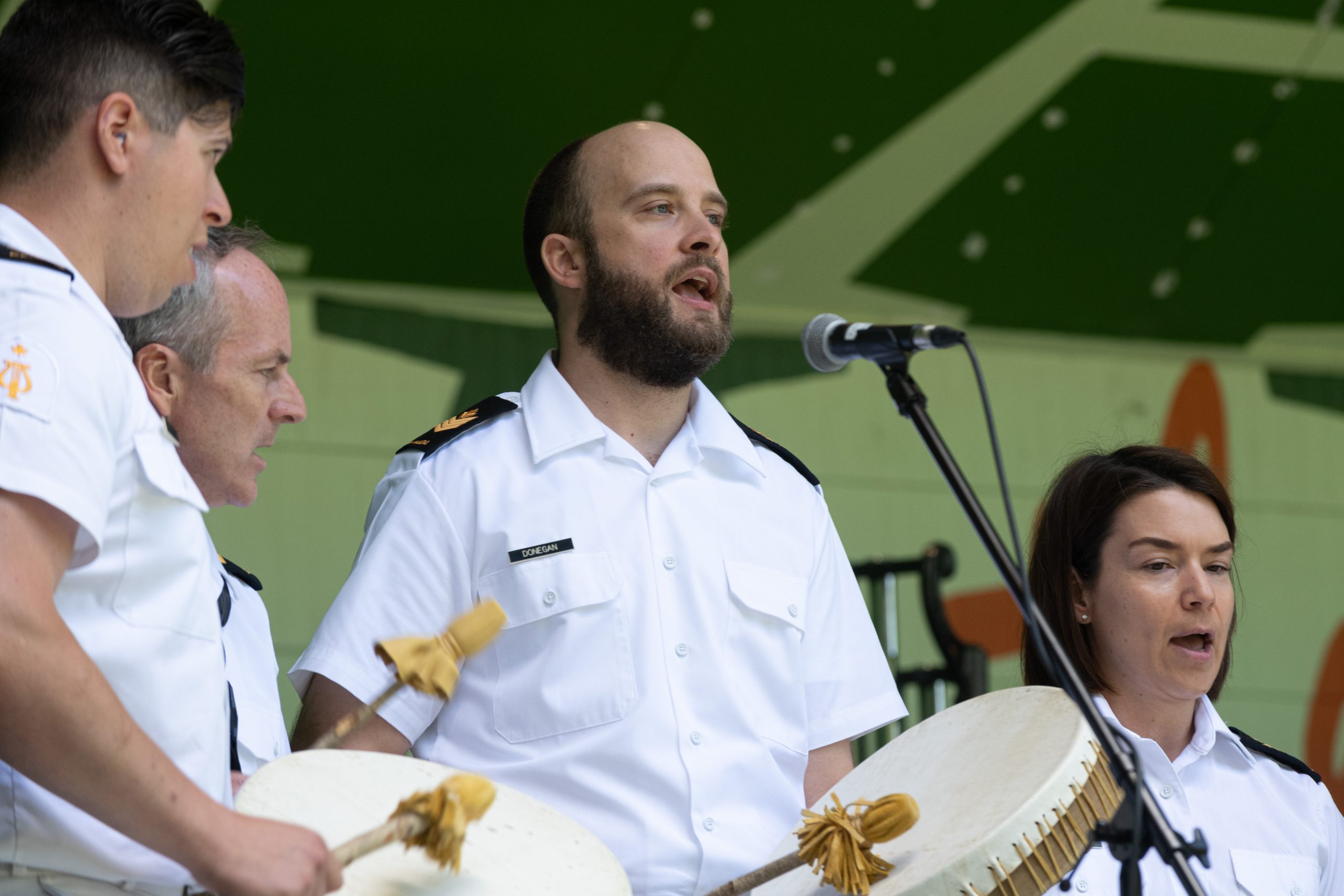 Members of the Naden Band of the Royal Canadian Navy perform for their summer concert.