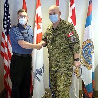 Sailor First Class Jeramie Welsh was presented with a Commander Canadian Joint Operations Command Coin for Excellence during deployment on RIMPAC 22 in Honolulu, Hawaii, by Vice-Admiral Bob Auchterlonie, Commander CJOC.