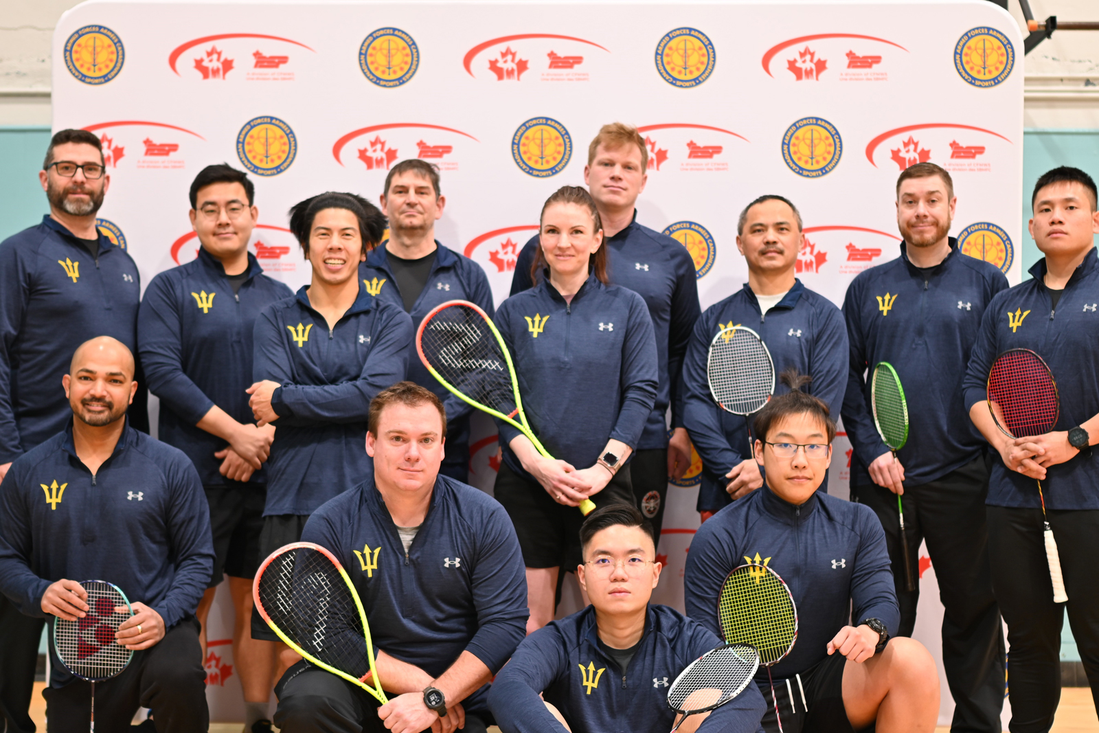 CFB Esquimalt Tritons squash and badminton team members pose together. Way to go!