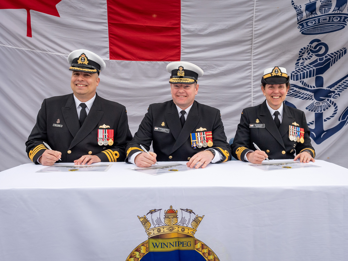 Commander Vincent Pellerin, incoming Commanding Officer of HMCS Winnipeg; Commodore David Mazur, Commanding Officer Canadian Fleet Pacific; Cdr Annick Fortin, outgoing Commanding Officer of HMCS Winnipeg during a Change of Command Ceremony held April 4.