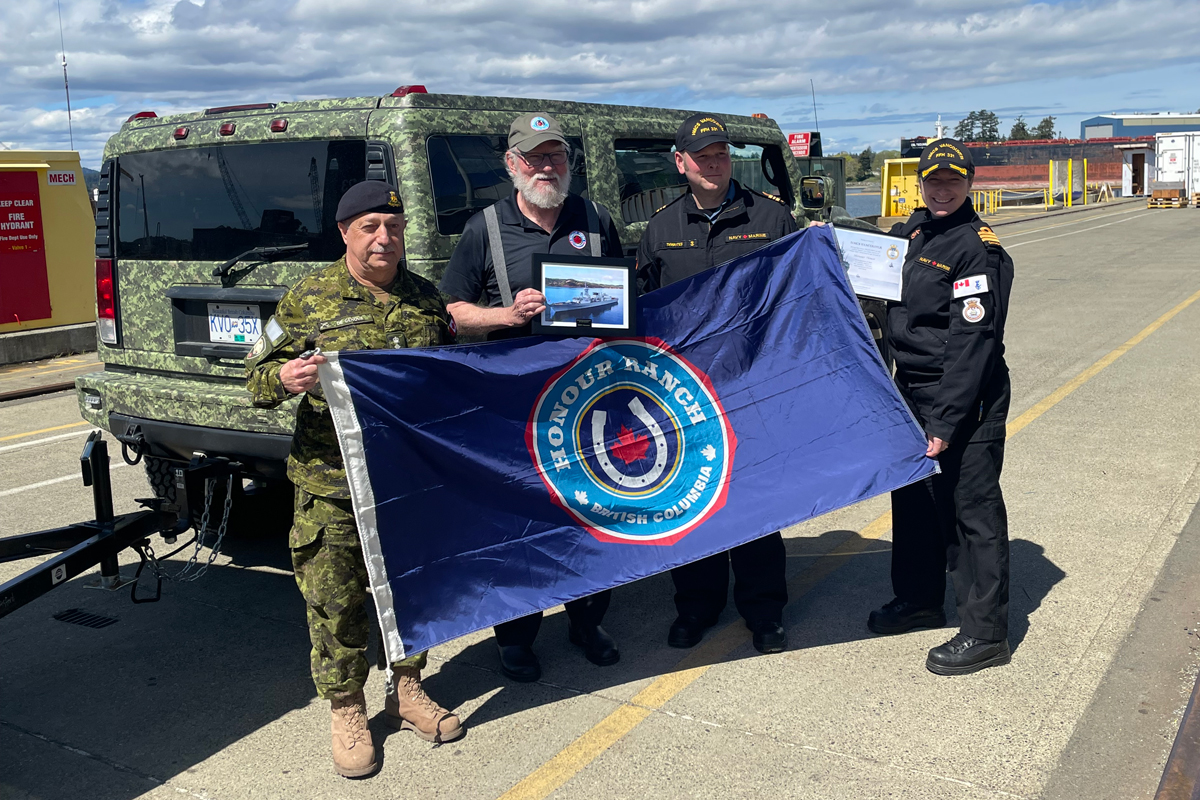 (Holding photo frame) Honour House President and Honorary Colonel of the 15th Field Artillery Regiment Al De Genova. 
Photo: Honour House Society