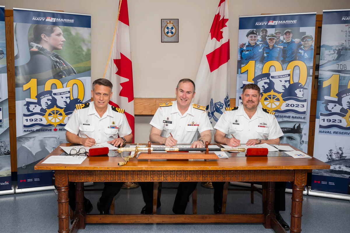 HMCS Scotian held a Signing Ceremony to mark its change of command on May 3. From left, Commander (Cdr) Wayne Shaddock, outgoing Commanding Officer, Commodore Patrick Montgomery, Commander of the Naval Reserve, and Cdr Kyle Penney, incoming Commanding Officer.
