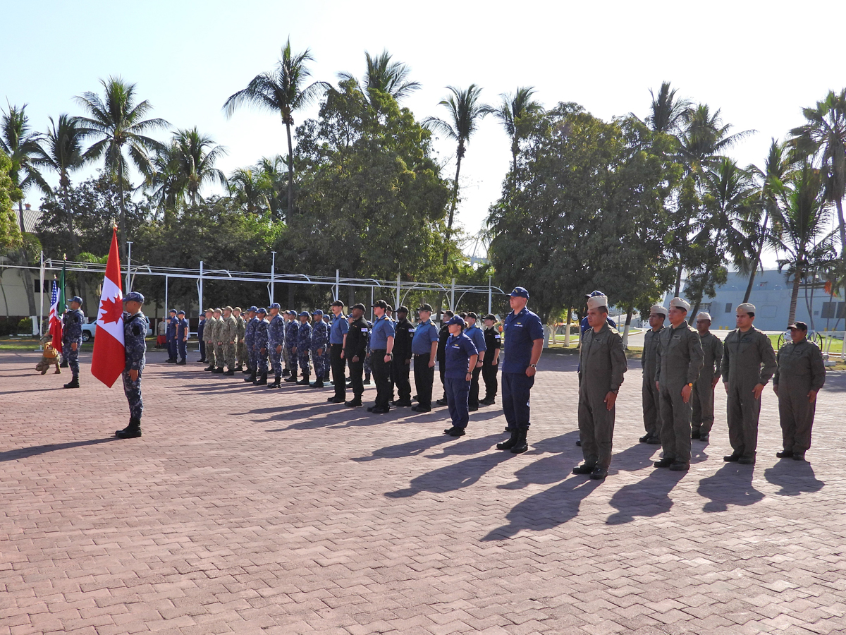 Sailors from His Majesty's Canadian Ship (HMCS) Edmonton join members of the U.S. Navy, Armada de México, and U.S. Coast Guard in paying respects to each country's national anthems on the parade square of the Manzanillo Naval Base during the opening ceremonies of the North American Maritime Security Initiative (NAMSI) on March 28. HMCS Edmonton participated in NAMSI, a multi-national effort between Canada, the United States and México to strengthen their security relationship while deployed on Operation Caribbe, Canada's contribution to U.S.-led Enhanced Counternarcotics Operations.