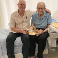 Michael Rose and Clyde Rose display the returned bell. Photo provided