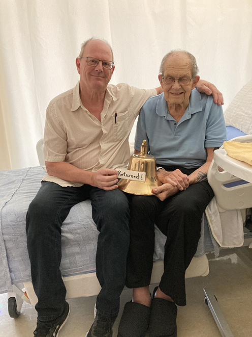 Michael Rose and Clyde Rose display the returned bell. Photo provided