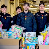 Angela Morehouse (left), Diane Edwards (second from right) and Daniella Palmieri (right), Victoria General Hospital Child Life Department Staff, accept a $4,000 delivery of toys and gift cards from Master Sailor (MS) Kayleigh Ferris of Naval Fleet School (Pacific) and HMCS Regina members Sailor First Class Billy Turner, Chief Petty Officer Second Class Trevor Moore and MS Zachary Kowalchuk. Monies raised for the donation came through the ship's Dave Barber Charity, named in honor of the ship's former Fire Control and Radar Technician who died of Leukemia in 1997. Credit: HMCS Regina