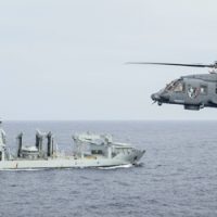 HMCS Vancouver’s embarked CH-148 Cyclone helicopter “CANUCK” flies near MV Asterix in the Pacific Ocean on 1 December 2023. Photo Credit: Aviator Gregory Cole, Canadian Armed Forces Photo L’hélicoptère CH-148 Cyclone « CANUCK » embarqué du NCSM Vancouver vole à proximité du NM Asterix, dans l’océan Pacifique, le 1er décembre 2023. Photo : Aviateur Gregory Cole, Forces armées canadiennes