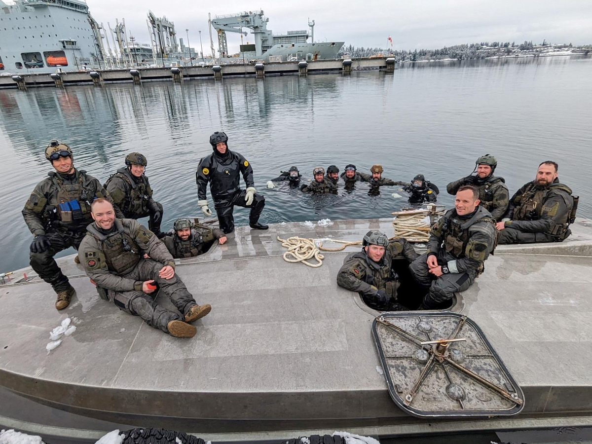 RCMP Marine Tactical Operations Instructors gather for a group picture on ‘D’ Jetty during a training exercise involving a capsized boat, Jan. 17.