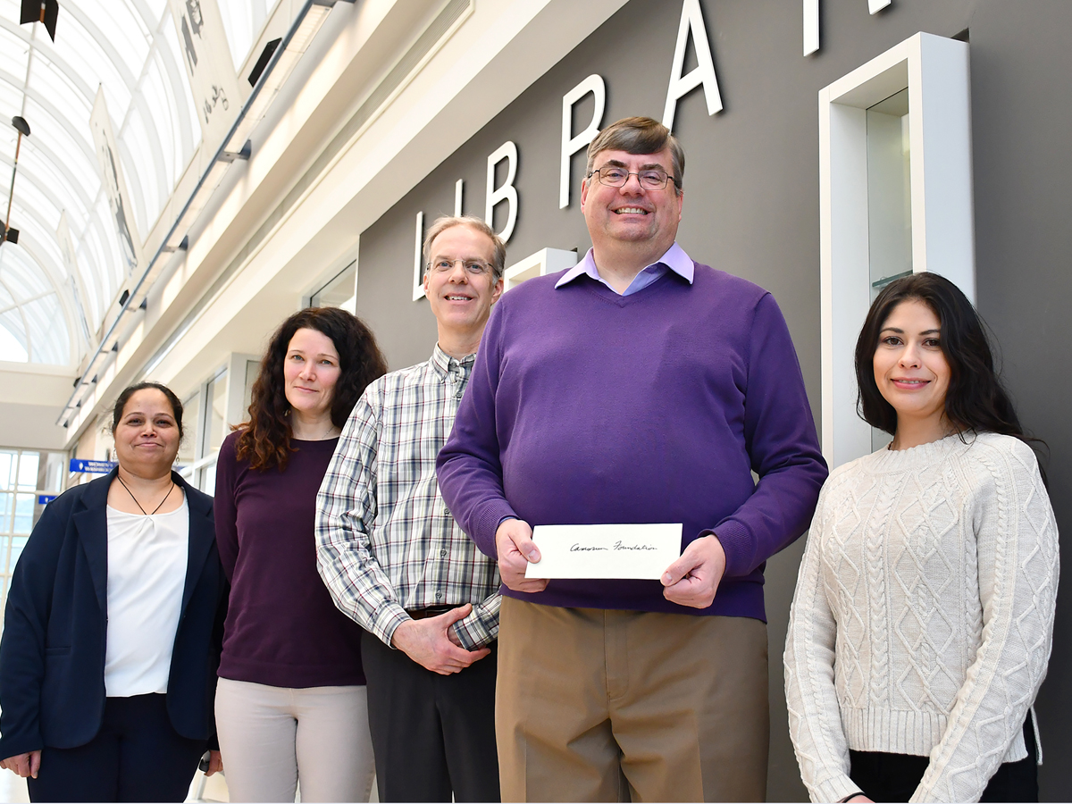 The Camosun College Foundation team celebrates the generosity of Naval Training Group employee Commander (ret’d) Angus Fedoruk (second from right).
