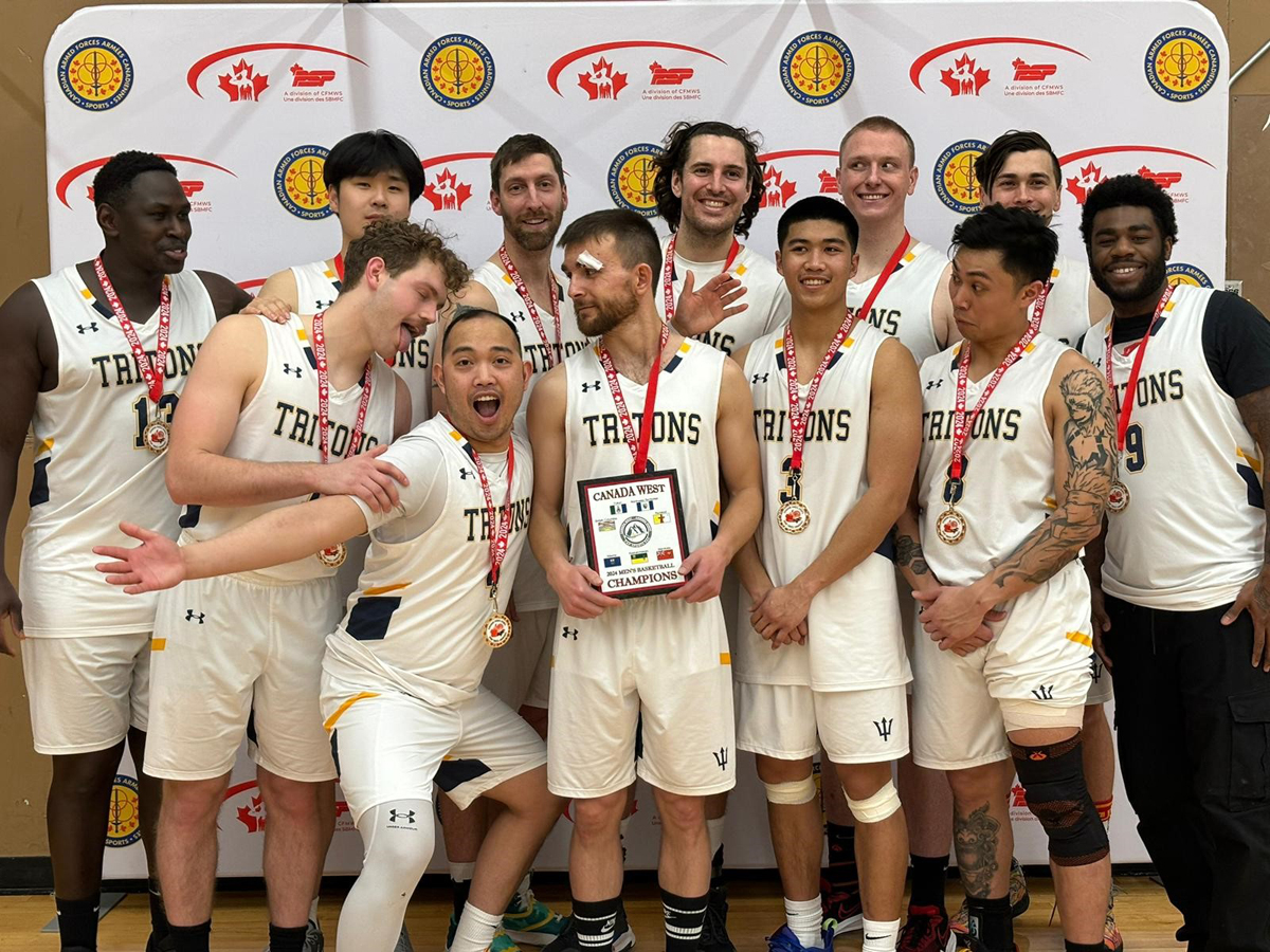 Members of the Esquimalt Tritons men’s basketball team celebrate their 76-44 victory over Cold Lake in the championship game of the Canada West Regional Basketball Championship, Feb. 17 in Moose Jaw, Sask.

