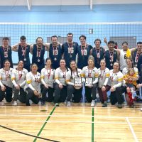 Members of the Esquimalt Tritons women’s and men’s volleyball teams celebrate their Canada West Regional Volleyball Championship victories, Feb. 16 in Winnipeg, Man. The women defeated Edmonton 3-1 in their gold medal game while the men recorded a 3-0 win over Cold Lake.
