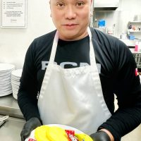 Master Sailor Rommel Billanes, Marine Technician of HMCS Calgary, proudly presents a nutritious and delicious breakfast for the residents of Our Place Society. Photos supplied