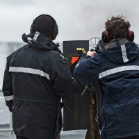 Royal Canadian Navy members run members of the NEP through a .50 Cal familiarity shoot.