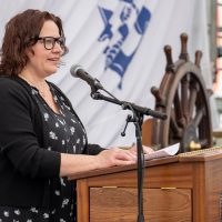 Shannon Bernays, granddaughter of Chief Petty Officer Max Bernays, addresses the audience of HMCS Max Bernays’ commissioning ceremony on May 3 in Vancouver. Photos: Corporal William Gosse, MARPAC Imaging.