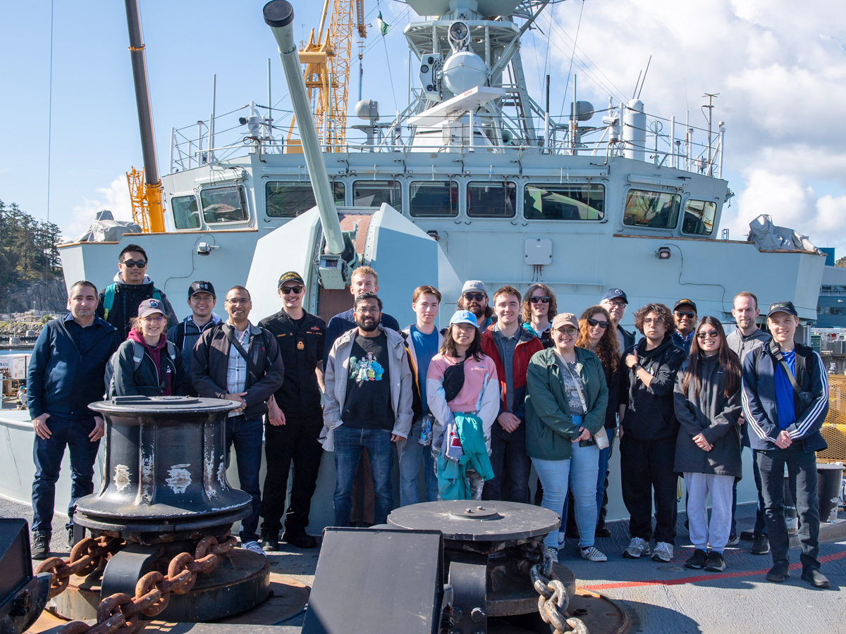 Canadian Students at Sea (CSaS) take a tour onboard HMCS Ottawa, and pose for a group photo on the foc’sle. Photo: Sailor 1st Class Brendan McLoughlin